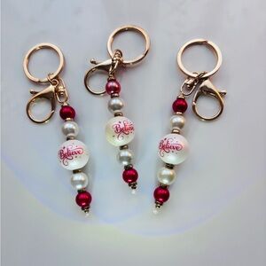 Set of three Christmas BELIEVE keychains